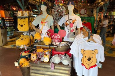 More Nostalgic 1990s-Style Winnie the Pooh Merchandise Arrives at Walt Disney World Featuring Plush Crossbody Bags, Collegiate Sweaters, & More